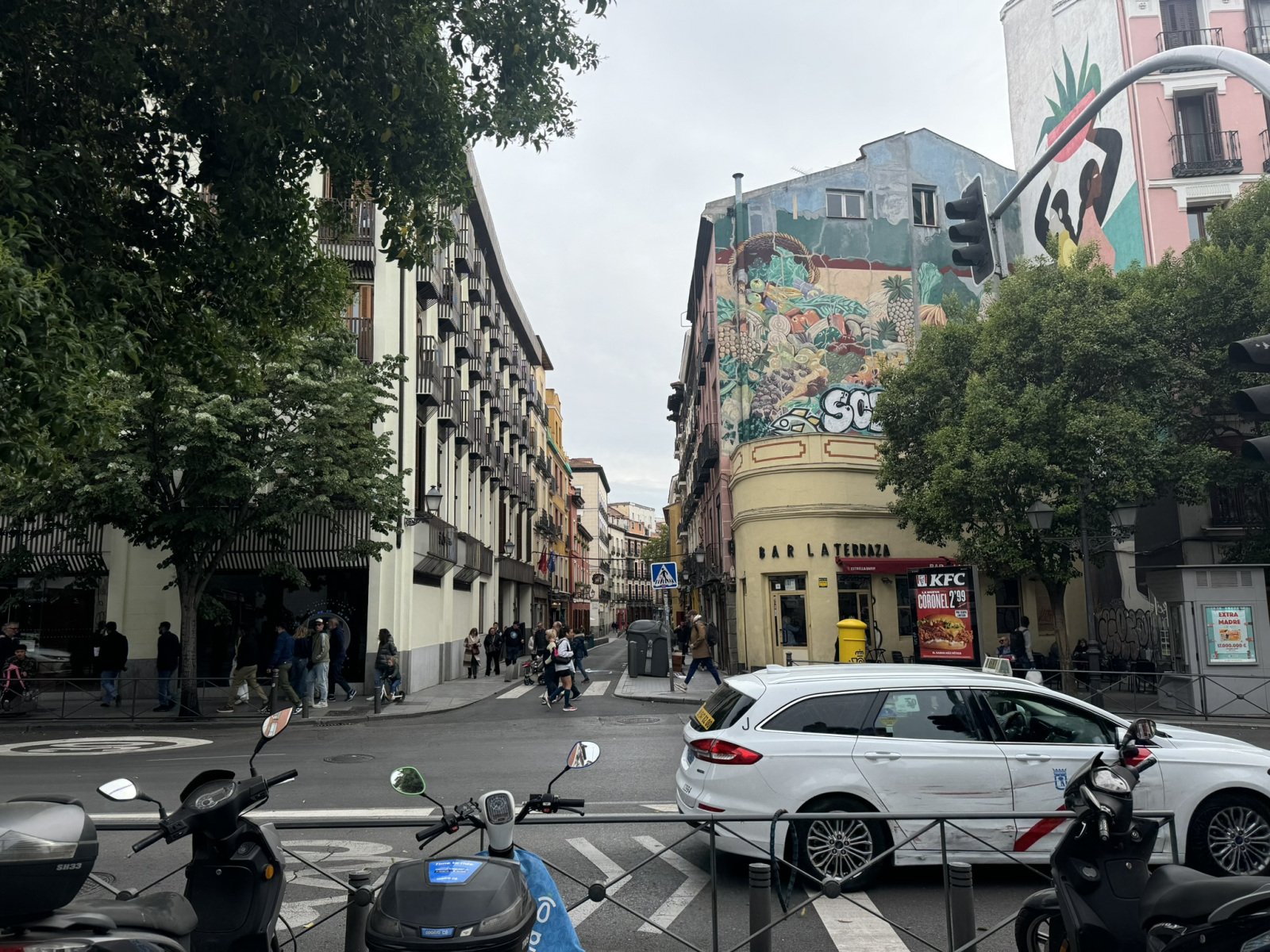Madrid street scene with a colorful wall mural.