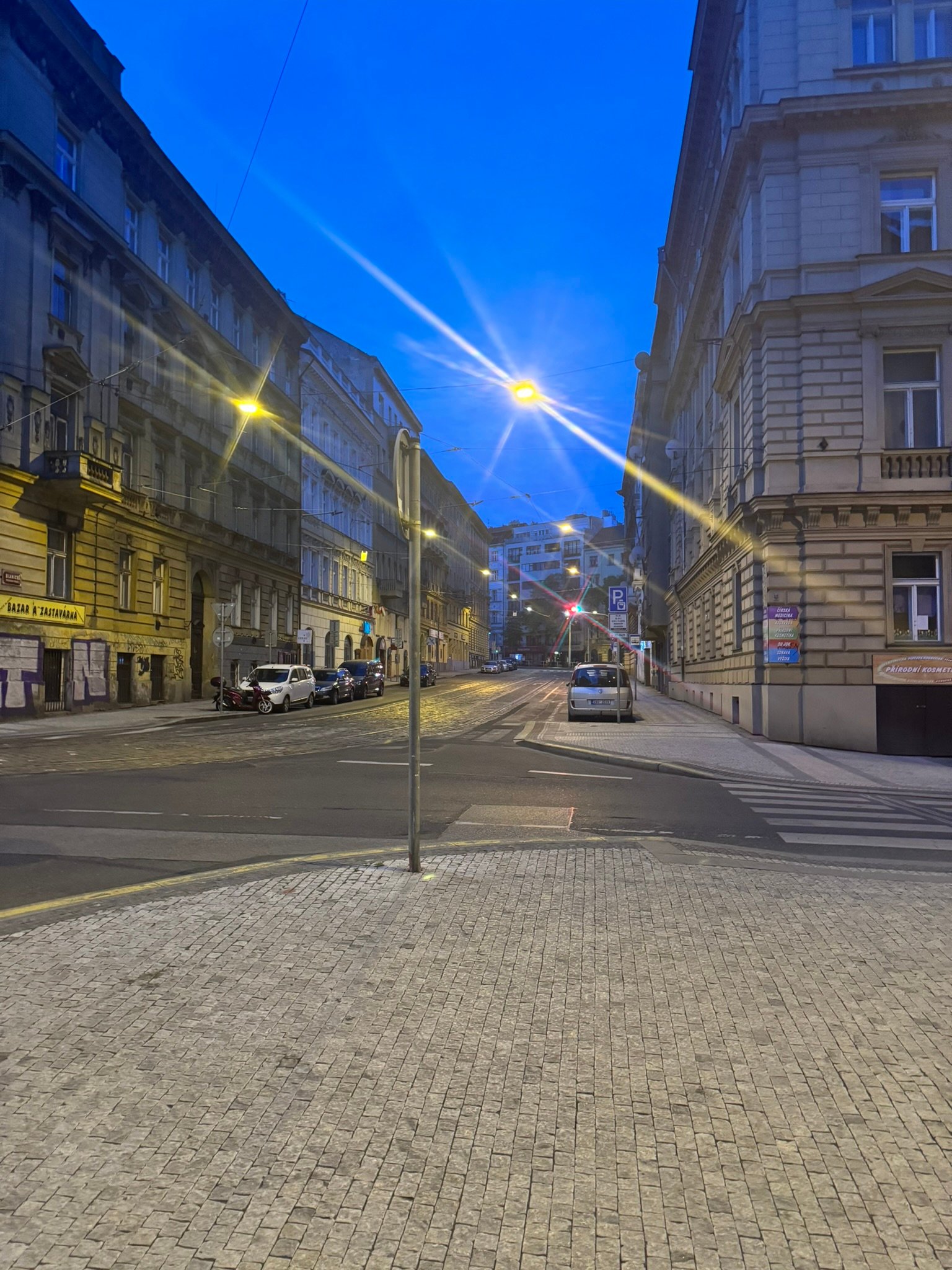 A quiet Prague intersection at dusk